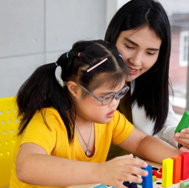 mom with girl with Down Syndrome - charter school special education program (SPED)