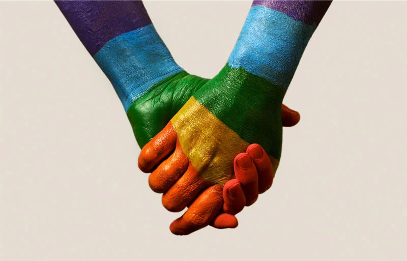 LGBTQ rainbow colored hands